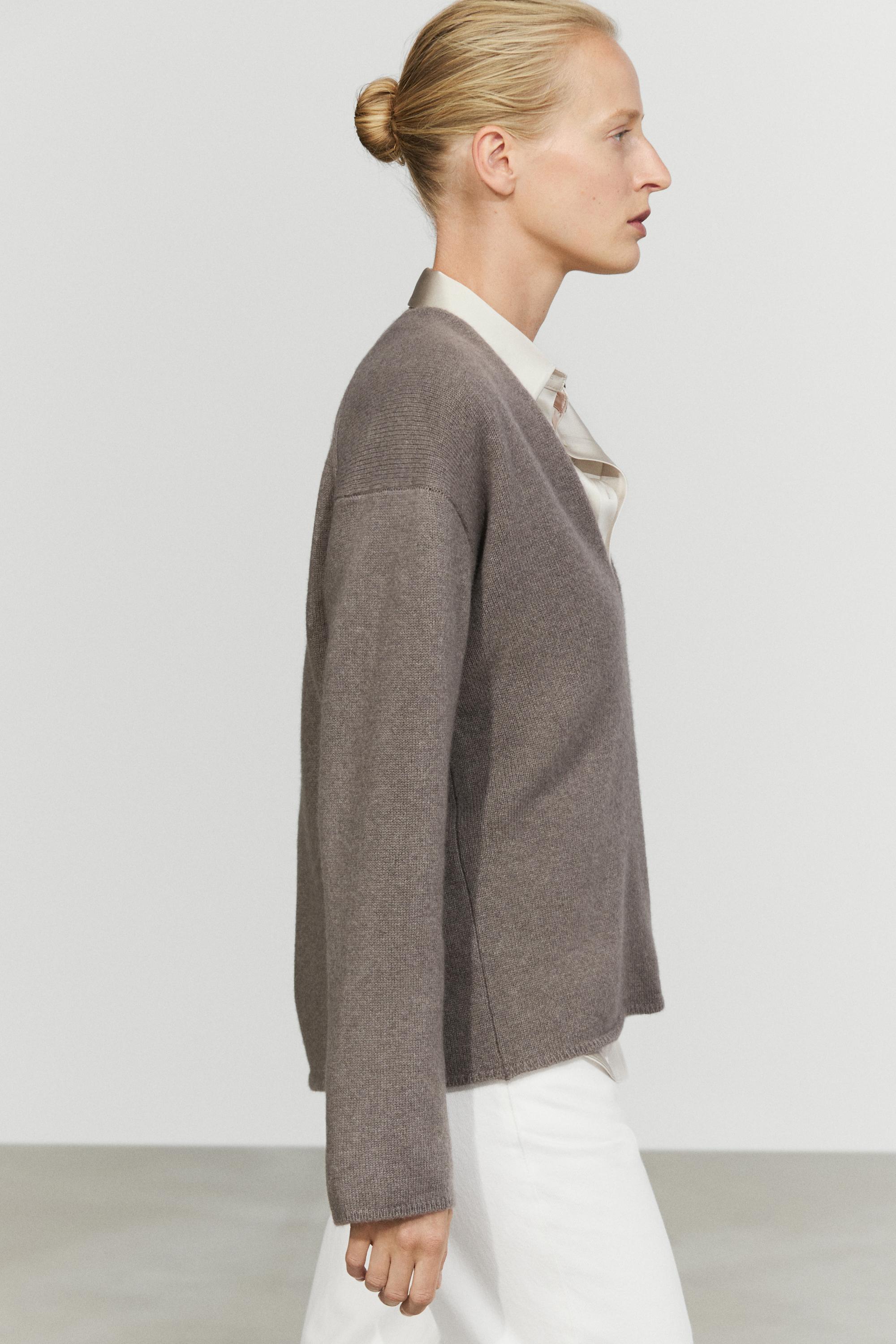 Long-line knit sweater with neckline detail